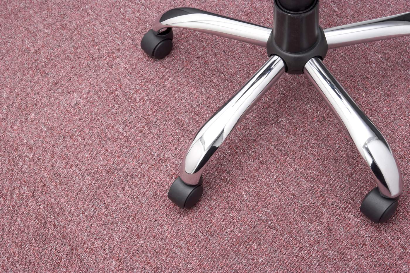 office chair wheels on a red-carpet